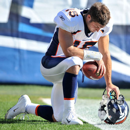 Tebow takes a knee for a brief prayer before each game (Newcom)