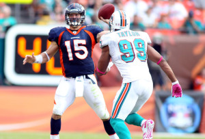 Tebow led the Broncos to an 18-15 OT win against the Miami Dolphins Oct. 23 (Photo by Marc Serota/Getty Images)