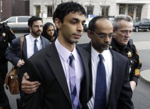 Dharun Ravi escorted by his father as they leave court on March 16 (Mel Evans/AP)
